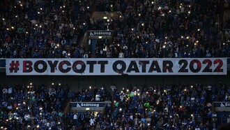 A large banner wishing people to boycott the Qatar World Cup