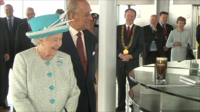 The Queen visited Dublin's Guinness Storehouse, where she was served a pint of Ireland's famous tipple.