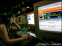 File image of a Chinese woman surfing the internet in an internet cafe