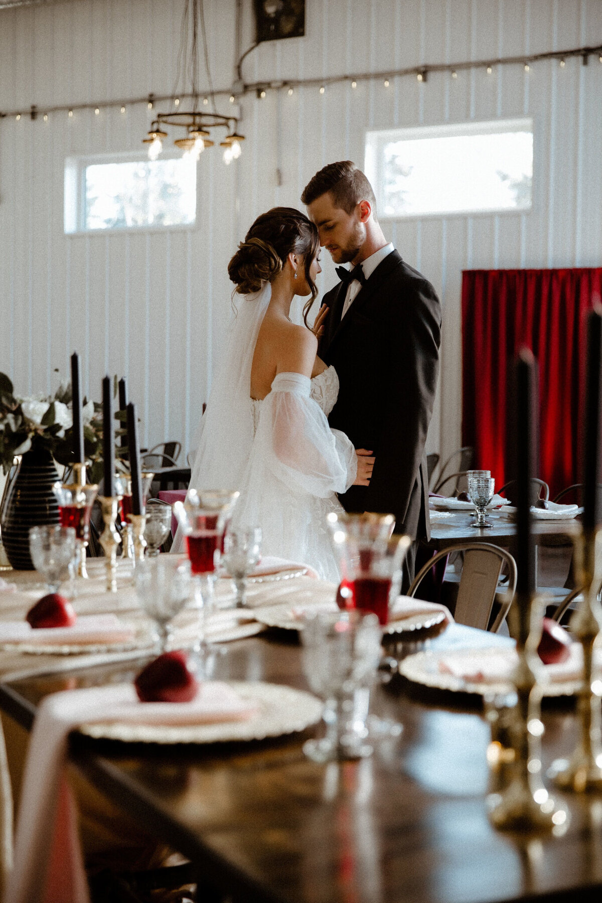 Bride and groom portrait at 52 North Venue, an industrial and unique wedding venue in Sylvan Lake, AB, featured on the Brontë Bride Vendor Guide.52 North Venue, an industrial and unique wedding venue in Sylvan Lake, AB, featured on the Brontë Bride Vendor Guide.