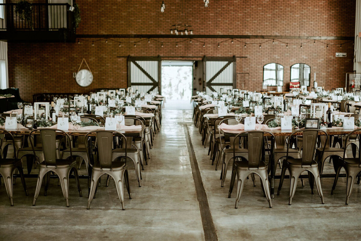 Wedding reception at 52 North Venue, an industrial and unique wedding venue in Sylvan Lake, AB, featured on the Brontë Bride Vendor Guide.52 North Venue, an industrial and unique wedding venue in Sylvan Lake, AB, featured on the Brontë Bride Vendor Guide.