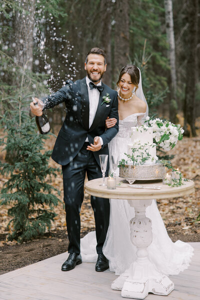 Couple popping champagne at Archway Manor, featured on Brontë Bride.