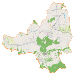 Mapa konturowa gminy Goleszów, blisko centrum na dole znajduje się ikonka zamku z wieżą z opisem „Zamek w Dzięgielowie”