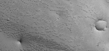 Field of small pits, as seen by HiRISE under HiWish program