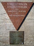 In the Berlin Nollendorfplatz subway station, a pink triangle plaque honors gay male victims. (Photo by: Manfred Brueckels.)