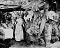 A U.S. Navy chaplain offers Catholic Mass for U.S. Marines at Saipan, June 1944.