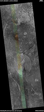 Wide view of mud volcano, as seen by HiRISE. The light-toned spots are the mud volcanoes. They have a different tone than the surroundings because they contain material brought up from depth. These structures may be useful to explore for remains of past life since they contain samples that would have been protected from the strong radiation at the surface. The colored strip is about 1 km wide.