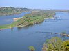 Oblique aerial view of a wide stretch of the Loire River with a large mainly wooded island