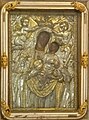 "Our Lady of the Harbor" with a painting of "Madonna and Child", framed by a silver relief