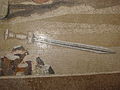 Detail of a fallen sword from the bottom right of the Mosaic (showing the individual tesserae)