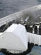 The MK 110 aboard the Bertholf firing during Combat System Ship Qualification Trials