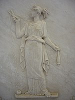 Atropos cutting the thread of life. Modern Greek low relief.