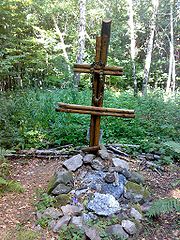 A cross and mound marking the site of the crash