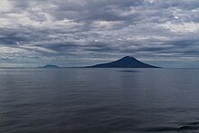 Matua and Rasshua Islands as seen entering the Golovnin Strait. Matua is in the foreground and Rasshua in the background.