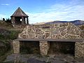 The Canterbury Pioneer Women's Memorial at the top of Bridle Path in New Zealand, with the Jane Deans memorial seat in the foreground