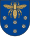 A coat of arms depicting a golden scarab with wings and legs outstretched flying over six purple flowers all on a blue background