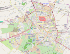 Mapa konturowa Zamościa, blisko centrum po prawej na dole znajduje się punkt z opisem „ulica Partyzantów”