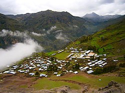 Awqa Urqu (in the background, on the right) as seen from Cochamarca (Quchamarka) in the southwest