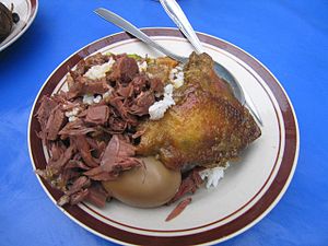 Gudeg (left), jackfruit curry with palm sugar (Indonesia)