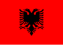 Red flag with a black double-headed eagle in the centre.