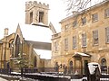 The Church of St Peter-le-Bailey, now the chapel of St Peter's College, on the left and the college porter's lodge on the right, in New Inn Hall Street