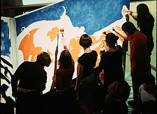 Participants help paint one of the frames of The 1 Second Film's animation.