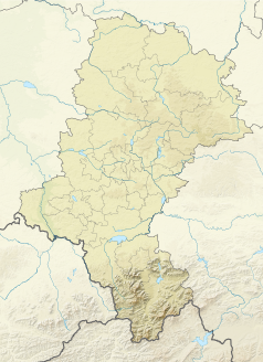 Mapa konturowa województwa śląskiego, w centrum znajduje się punkt z opisem „Katowice”