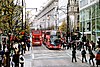 Looking west along Oxford Street, with two buses and Selfridges department store