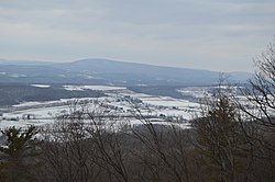 Snow-covered fields in late March, seen from Dunning Mountain