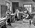 Image 60Students in a carpentry trade school learning woodworking skills, c. 1920 (from Vocational school)