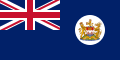 Navy Blue flag with Union Flag as top-left quarter and crest on right side.