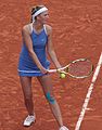 Victoria Azarenka prepares to serve at the 2009 French Open.