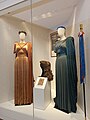 Callas' opera costumes from the 1960 Norma (costumes to the left and right) and the 1961 Medea (wig at the center), both performed in the ancient theatre of Epidaurus, and from the 1954 Tosca in Genoa, a thyrsus-like walking stick, right