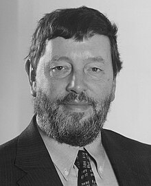 Head and shoulders portrait of a man in a suit