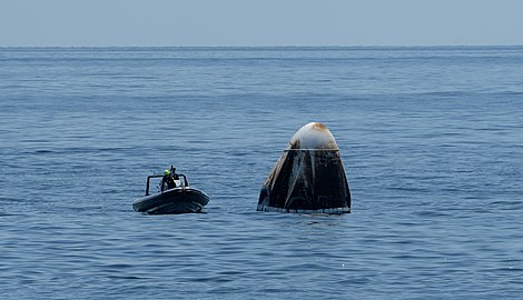 Support teams arrive in a fast boat at the SpaceX Crew Dragon Endeavour.