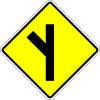 Skewed side road junction on the left