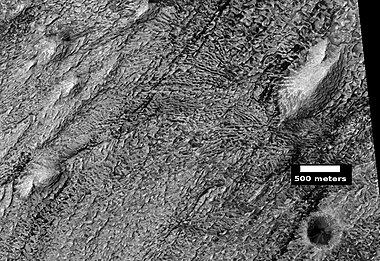 Layers, crater, and mounds on floor of Danielson Crater, as seen by HiRISE under HiWish program