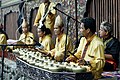 Image 45Talempong, a traditional percussion instrument from West Sumatra, consisting of a series of small gongs that are played by striking them with mallets. (from Culture of Indonesia)