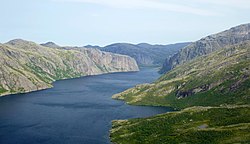 A wide river in between hills