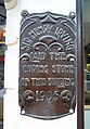 Plaque commemorating the coping stone laid by Henry Irving in 1905