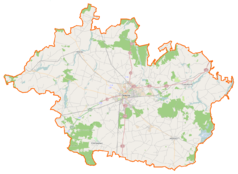 Mapa konturowa powiatu gnieźnieńskiego, blisko centrum po prawej na dole znajduje się punkt z opisem „Parafia św. Andrzeja Apostoła”