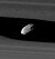 Two bright bands run from the left to right. In the narrow gap between them (Keeler gap), which has wavy edges, a small oblong object can be seen.