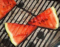 Watermelon steaks on a grill