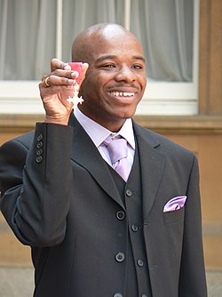 Stephen Wiltshire holding MBE