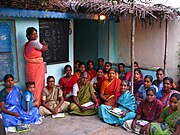 Women attend an adult literacy class in Thiruputkuzhi, Tamil Nadu state. The overall female literacy rate in the state in 2011 was 73.44%. In the previous decade, it had increased by 9%.[7]