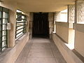 Tunnel-like entrance with hollyhock carvings