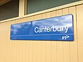 The platform signage attached to the station building, May 2018