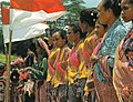 Image 63Timorese women with the Indonesian national flag (from History of Indonesia)