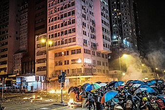 Police firing tear gas at protesters attempting to reach the cordon