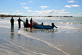 Fisherman selling his catch of the day at the beach of Paternoster